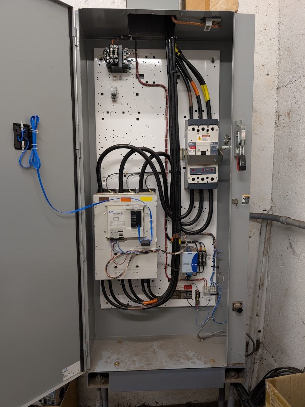 Industrial control cabinet with a soft starter, breaker and control wiring