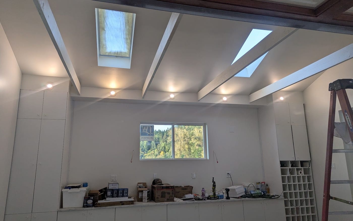 Finished interior with recessed ceiling lighting and skylights