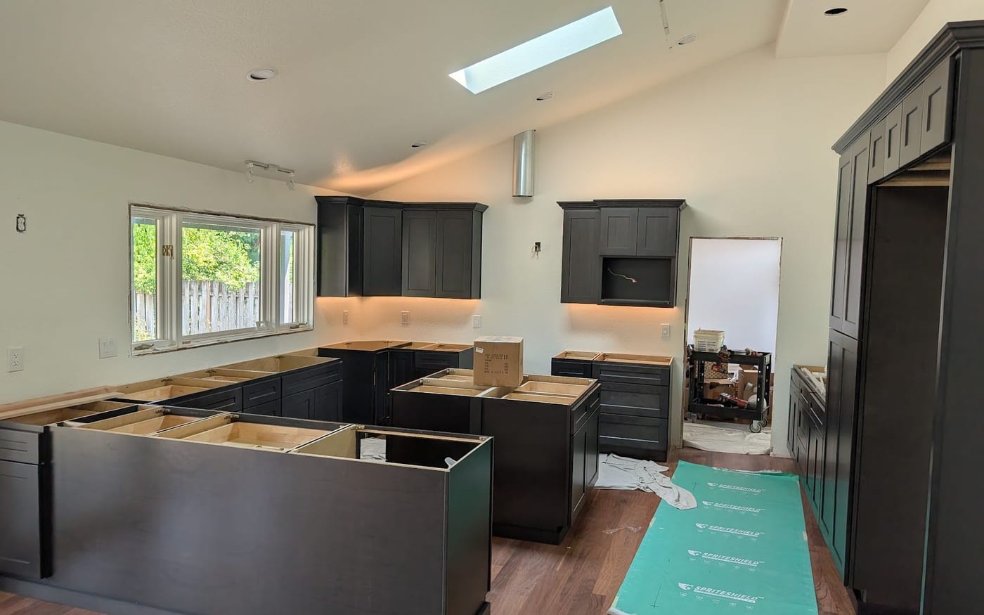 Kitchen with under-cabinet and recessed lighting installed by Paragon Electric