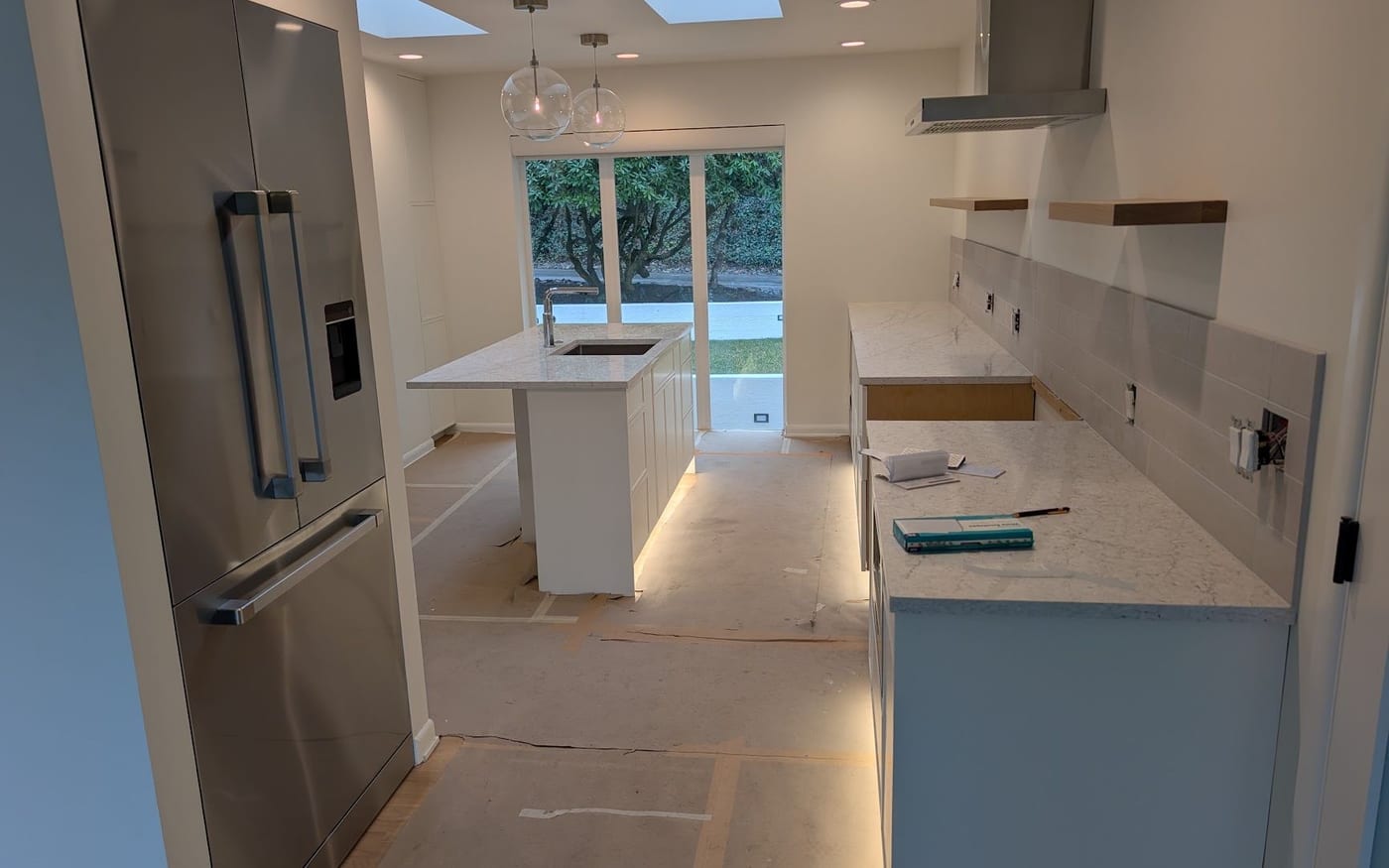Kitchen with pendant lights, recessed cans and under-cabinet lighting