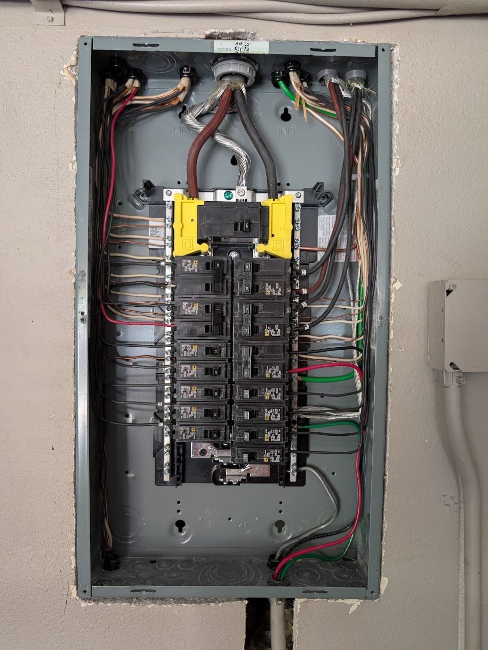 Newly installed residential panel with circuit conductors neatly dressed